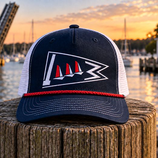 Navy and white trucker hat with the Mystic Model Yacht Club burgee stitched on the front